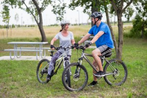 Jewel and her husband bicycle workout