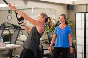 Jewel provides fitness instruction to client